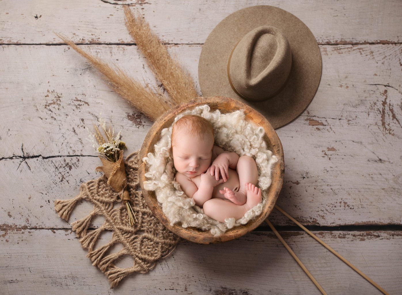 newborn baby in country themed digital backdrop