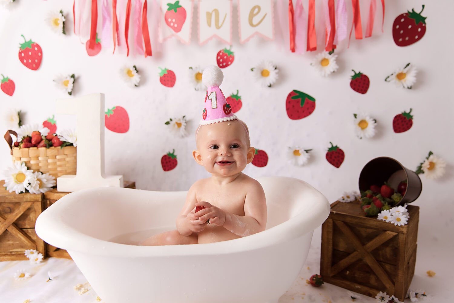 Strawberry and Daisy's on a white backdrop for a berry first birthday cake smash by Melbourne cake smash photographer Aurora Joy Photography