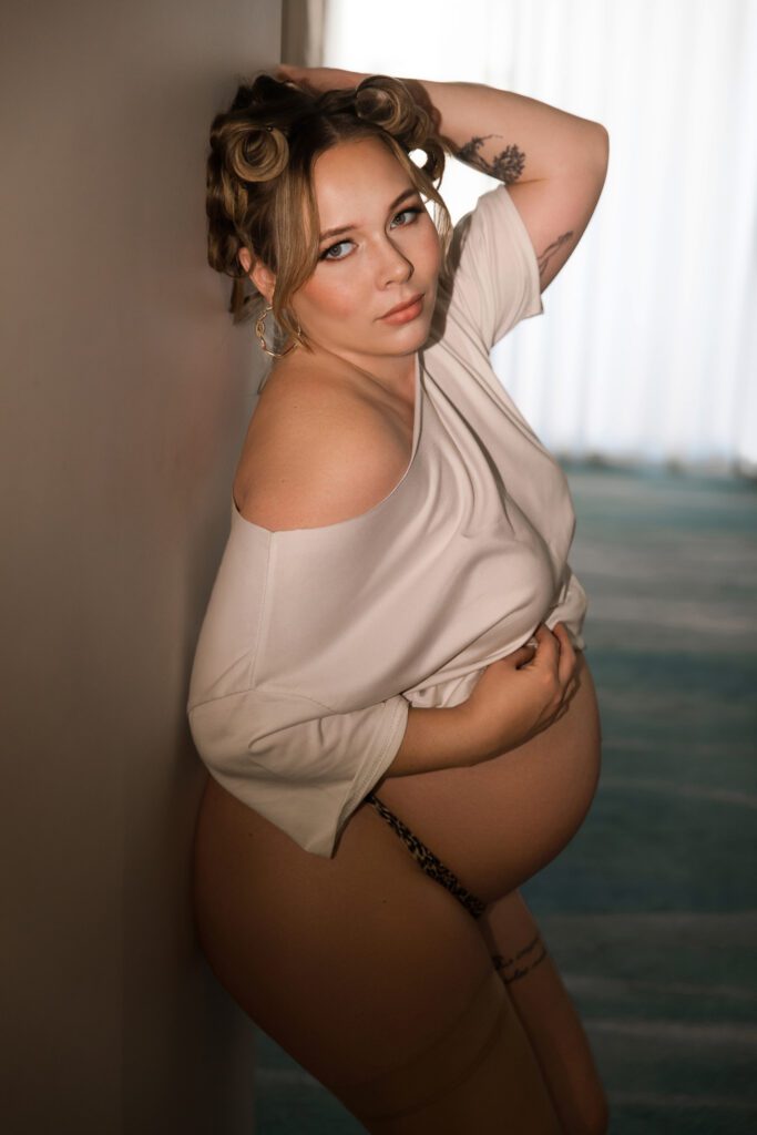 Elegant side profile of an expectant mother showing her beautiful bare baby bump — maternity photography by Aurora Joy Photography, Scarborough Western Australia