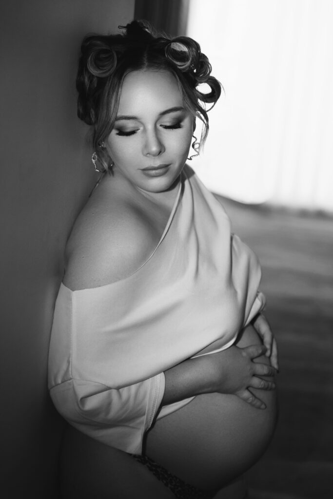 Black and white side profile of an expectant mother showing her bare baby bump — maternity photography by Aurora Joy Photography, Scarborough Western Australia