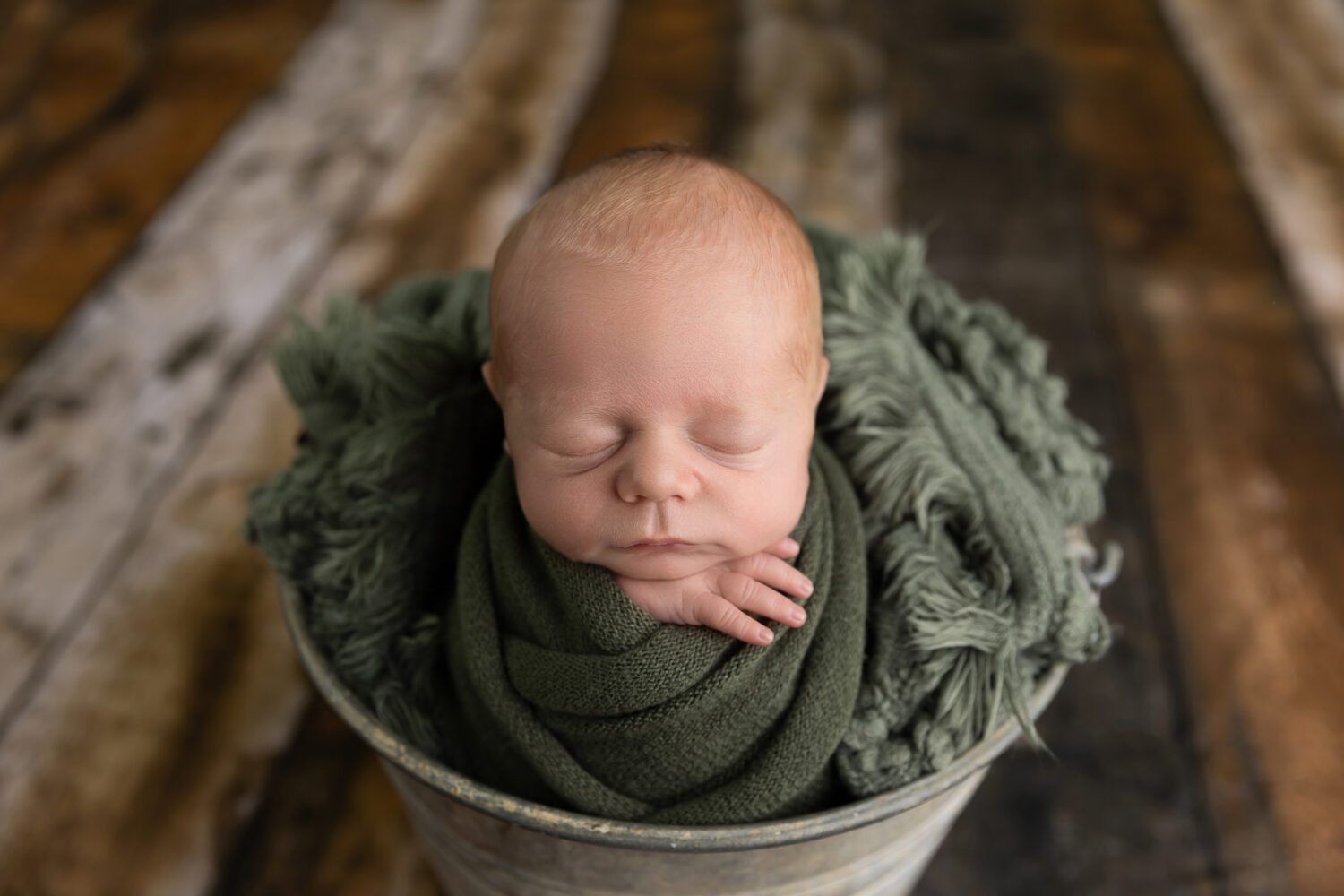 newborn photographer Perth close up view of a sleeping newborn baby boy in a galvanised tin bucket — newborn photography by Aurora Joy Photography, Stirling Western Australia