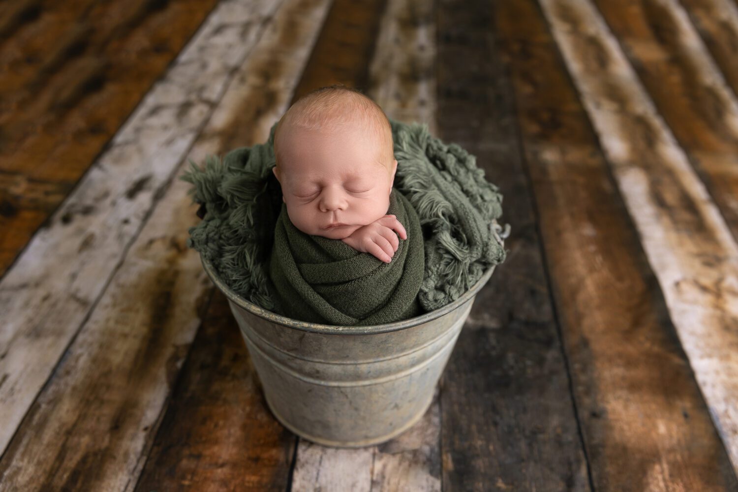 aerial view of a sleeping newborn baby boy in a galvanised tin bucket — newborn photography by Aurora Joy Photography, Stirling Western Australia